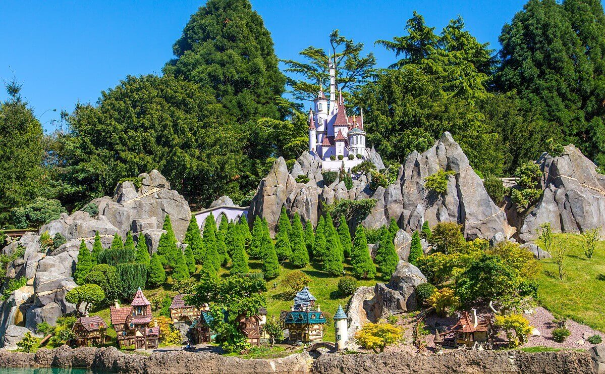 Belle's village and the beast's castle The castle of the Beast towers over the small idyllic village of Belle at Le Pays des Contes de Fees