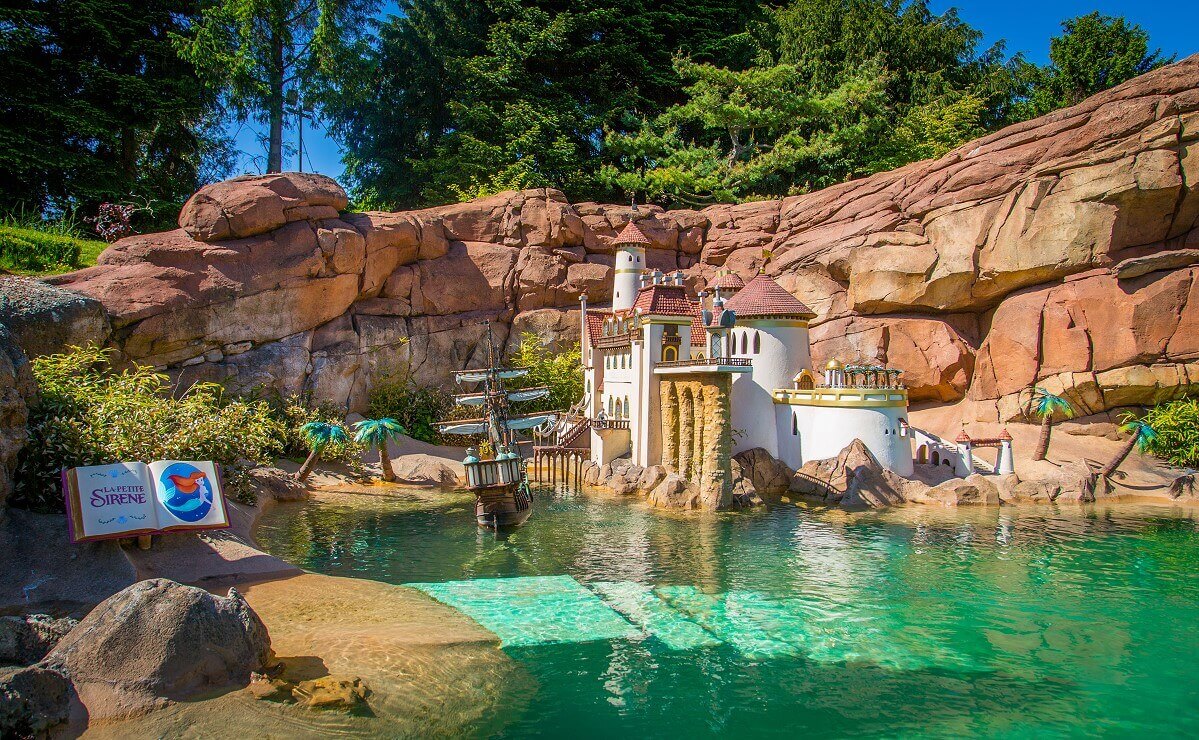Prince Eric's Castle at Le Pays des Contes de Fees View of the small bay with Prince Eric's castle at the attraction Le Pays des Contes de Fees in Fantasyland