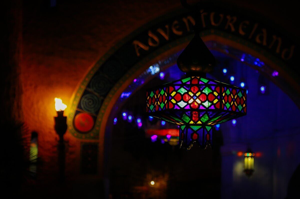 Colourful lantern in front of the entrance to Adventureland Night shot of a colorful oriental lantern in front of the entrance to Adventureland