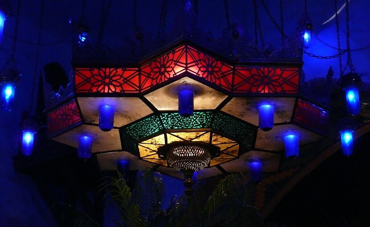 Colorful candlestick at night A colourful candelabra shines in the night at the Adventureland Bazaar