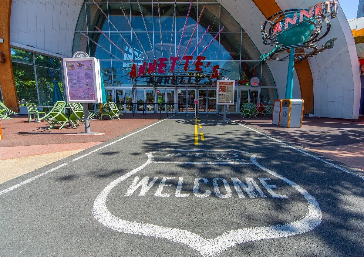 Highway to Annette's The way to the entrance is designed as a US highway with the text Annette's Diner Welcome in a classic street sign of the USA