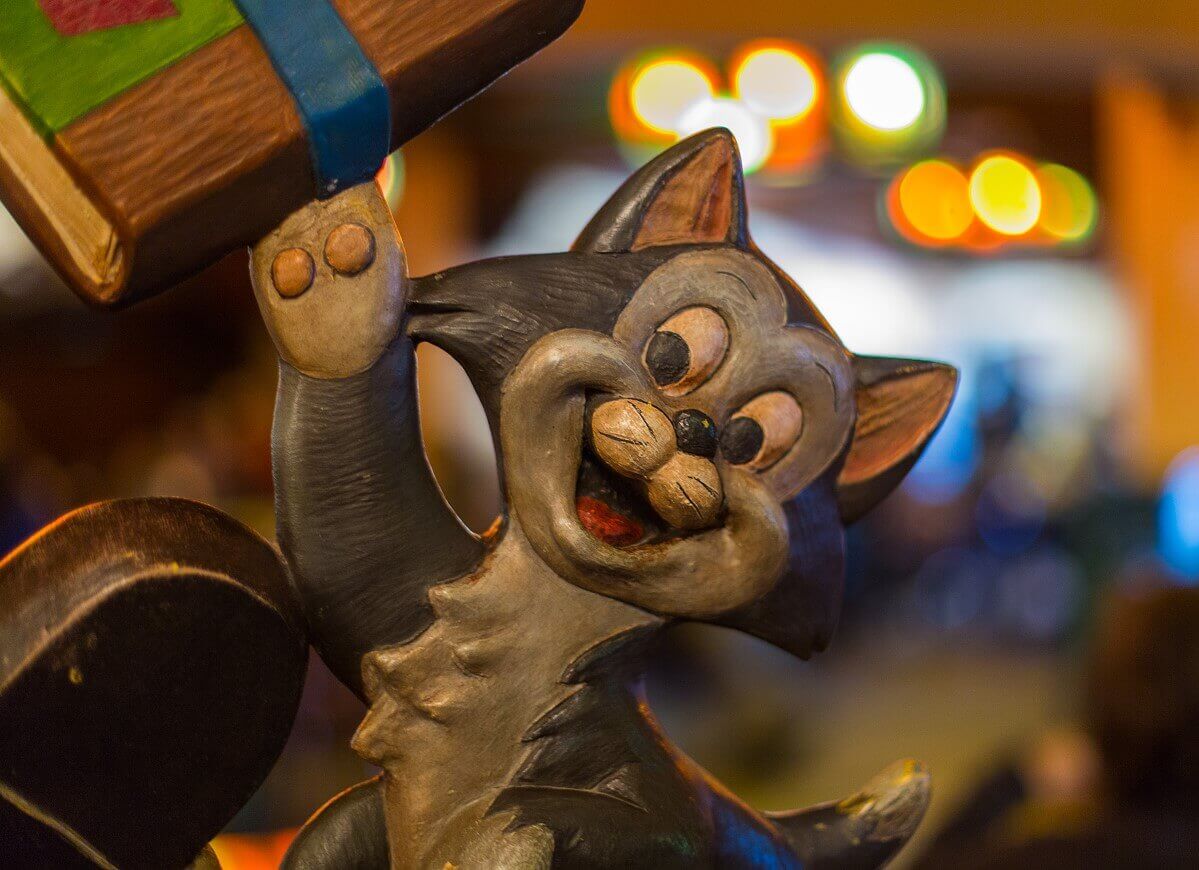 Figaro at the Chalet de la Marionette Close-up of a wooden carving of Figaro the cat in the fast food restaurant Au Chalet de la Marionette in Fantasyland