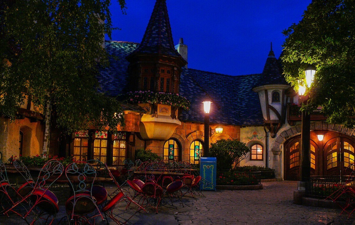 The Chalet de la Marionette by night Night shot of the illuminated Au Chalet de la Marionette in Fantasyland