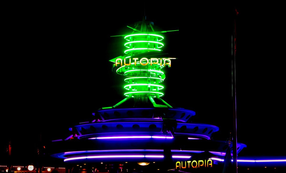 Autopia by night Green fluorescent tube tower on the roof of the waiting area of the Autopia attraction