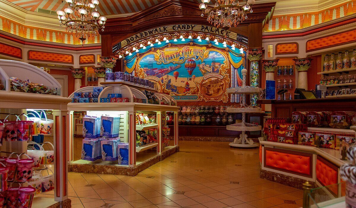 Interior view of the Boardwalk Candy Palace Interior view of the Boardwalk Candy Palace: shelves full of candy and a large mural of Atlantic City 1892 on the back wall.