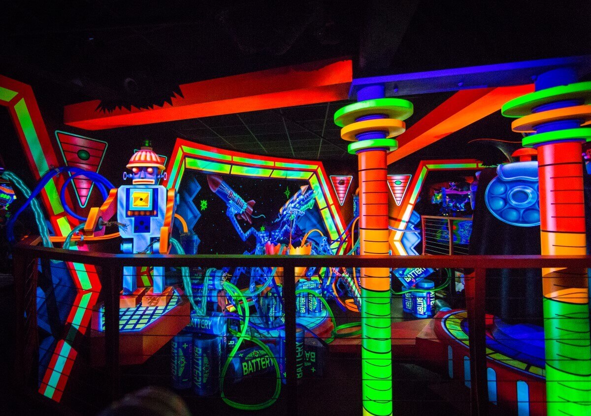 Buzz Lightyears Laser Blast from inside View of the interior of Buzz Lightyear's Laser Blast attraction in futuristic design and neon colours
