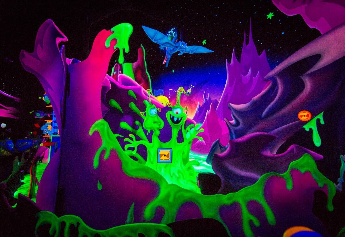 Slimy Alien in one part of the attraction Buzz Lightyear Laser Blast you can see a green slimy alien with two heads