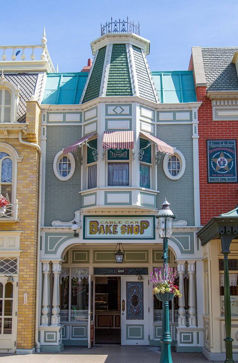 The Cable Car Bake Shop building The building of the Cable Car Bake Shop: The facade is built of grey bricks and decorated with wooden elements and red and white awnings in front of the windows on the 1st floor