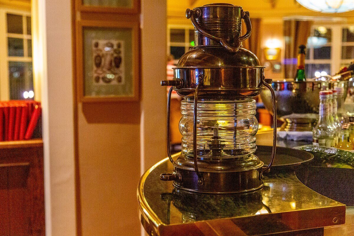 Captain Quarters Bar An old kerosene lamp stands on the counter.