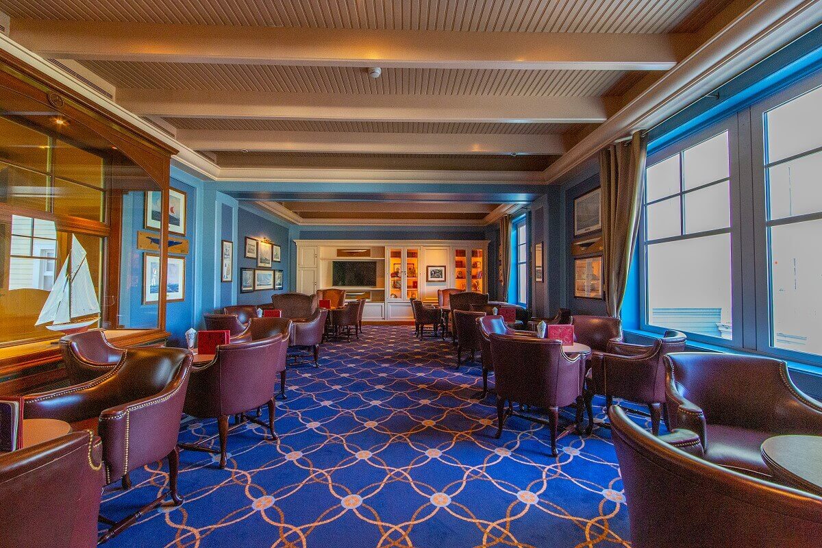 Captain Quarters Bar The seating area of the bar with leather armchairs in maritime style.