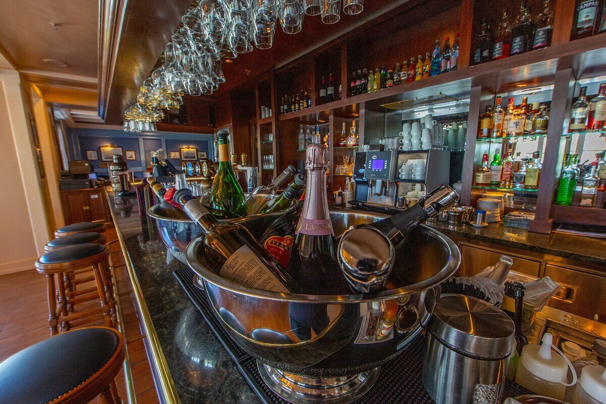 Captain Quarters Bar Different bottles are chilled on the counter in beverage buckets.