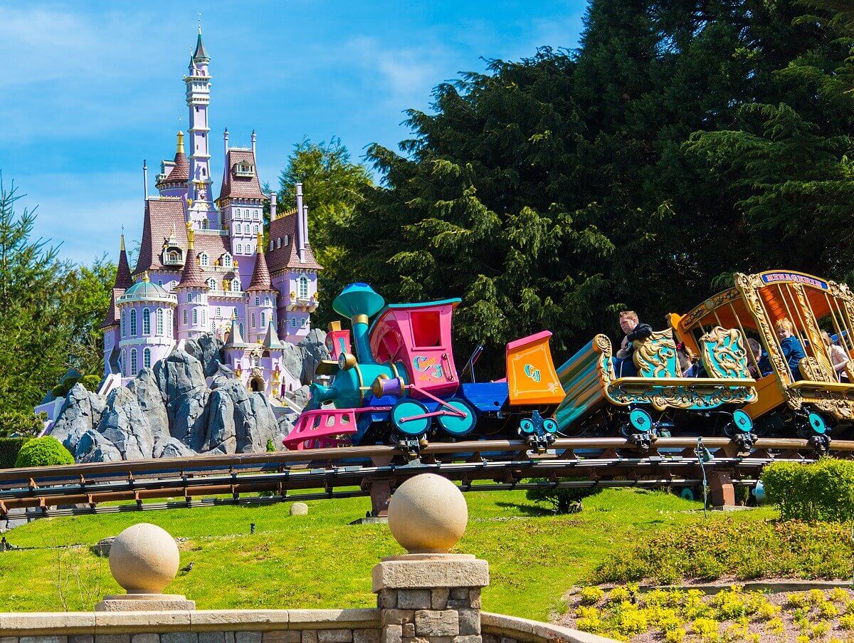 Casey Jr. on a roll The Casey Jr. circus train from the Disney classic Dumbo travels along a section of track alongside a fairytale castle