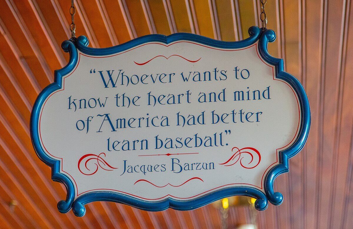 Quote from Jaques Barzun on a sign Quote from Jaques Barzun on a sign hanging from the ceiling: Whoever wants to know the heart and mind of America had better learn baseball