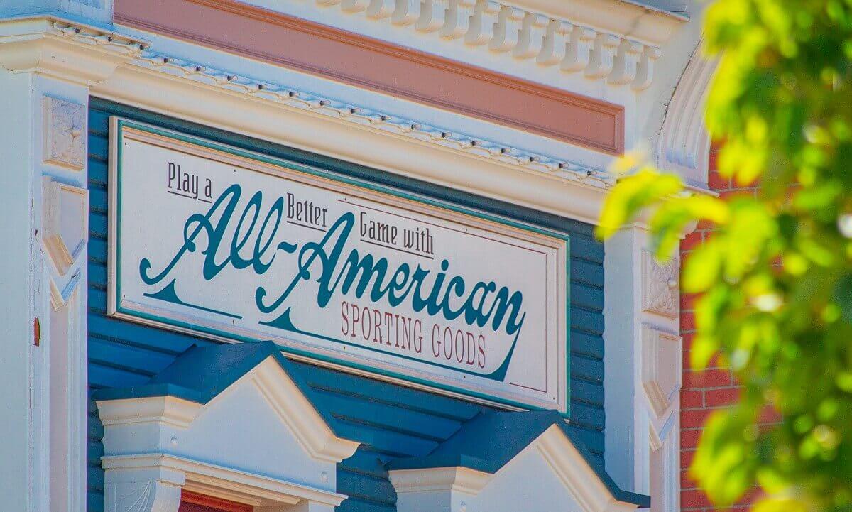 Advertising board on the facade Billboard on the facade: Play a Better Game with All-American Sporting Goods