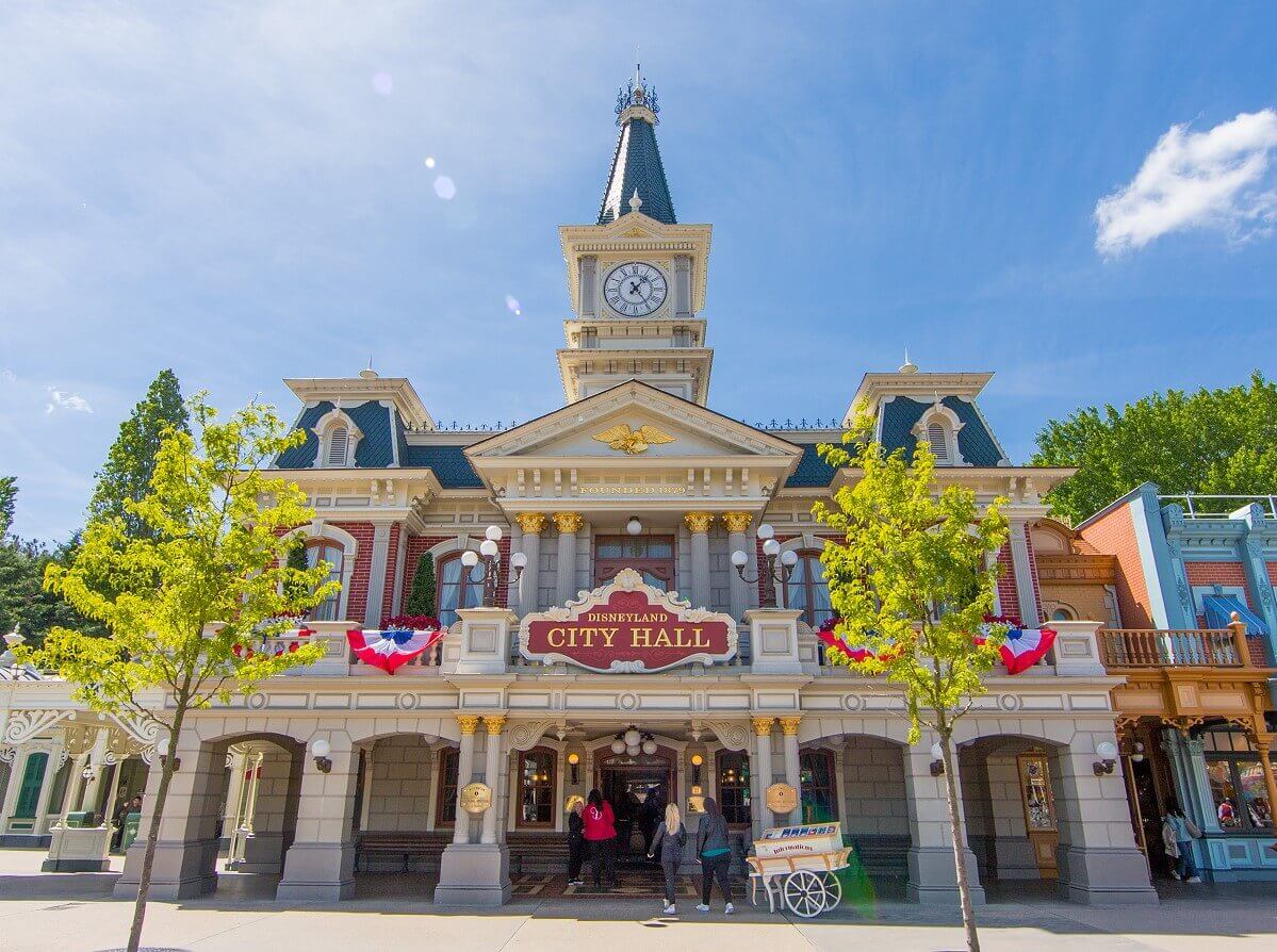 Front of City Hall Front of City Hall with the sign Disneyland City Hall above the entrance. Above it on the canopy of the first floor is a golden eagle, below the writing Founded 1879