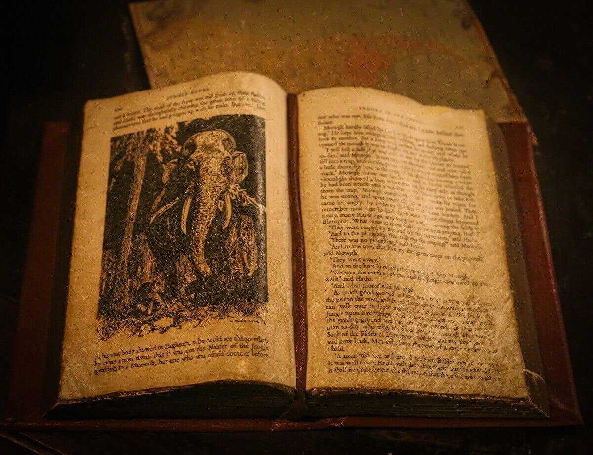 Book as a decorative element An open book in Colonel Hathis shows an excerpt from The Jungle Book