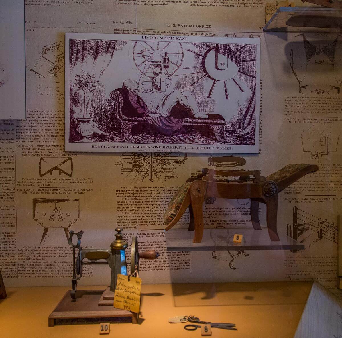Patent models of a deck chair with wine drinking function and a sewing machine Patent models of a deck chair with wine drinking function and a sewing machine