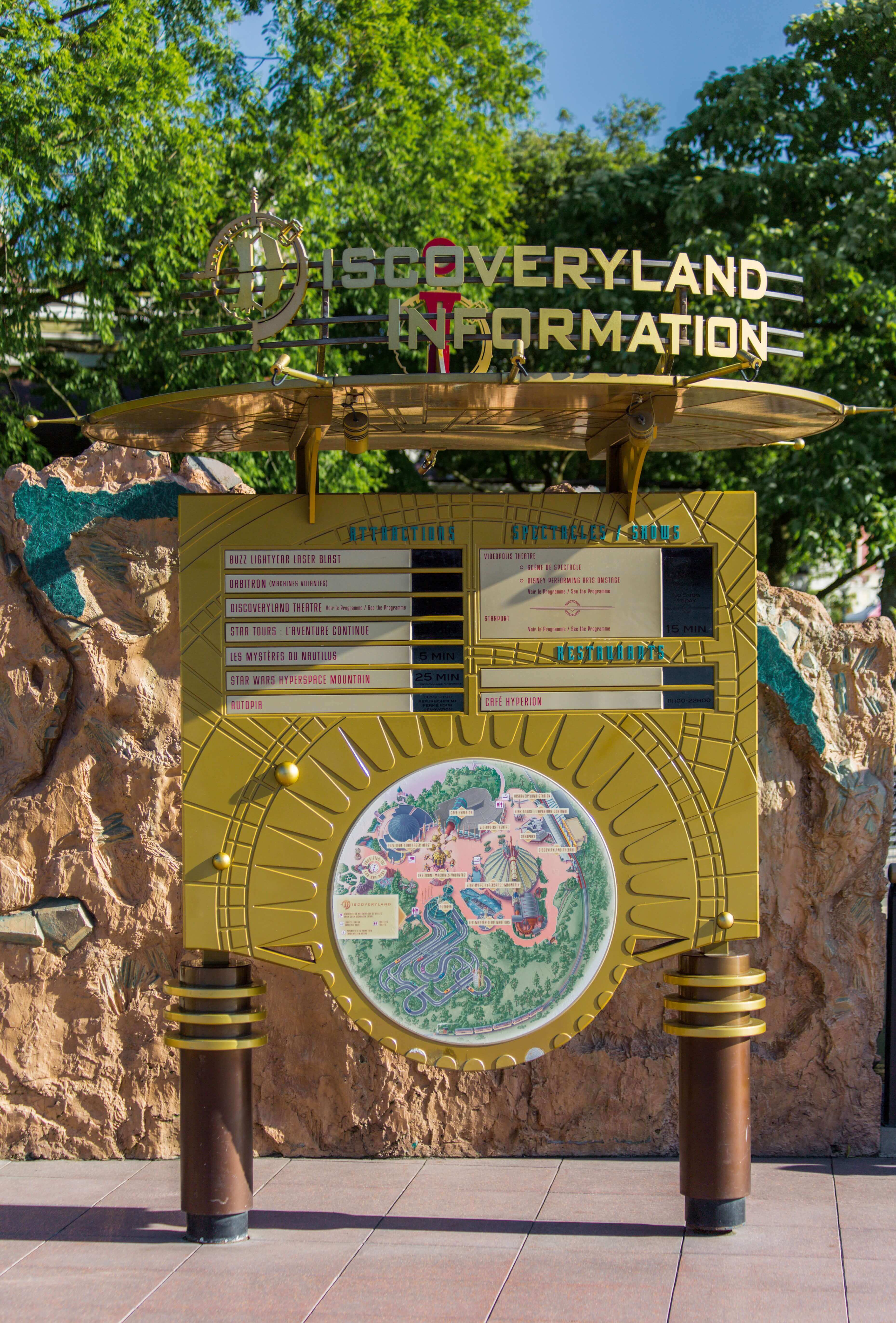 Information board View on a futuristic looking information board with the lettering Discoveryland Information