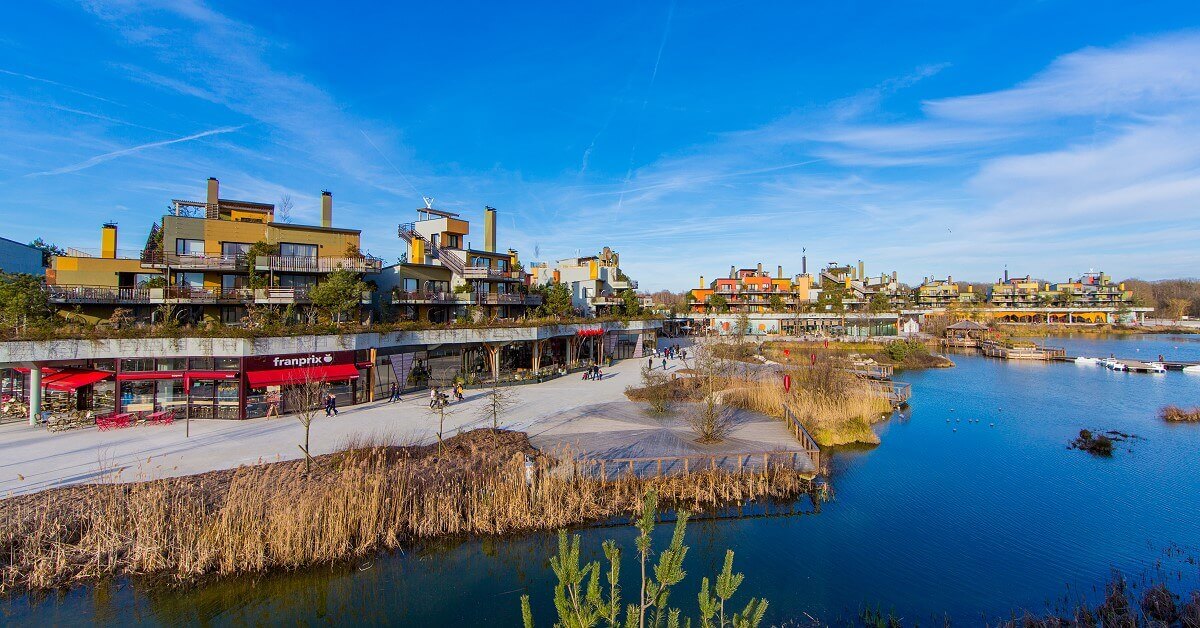 Disney Nature Resorts View over the lake promenade in Villages Nature, one of the Disney Nature Resorts