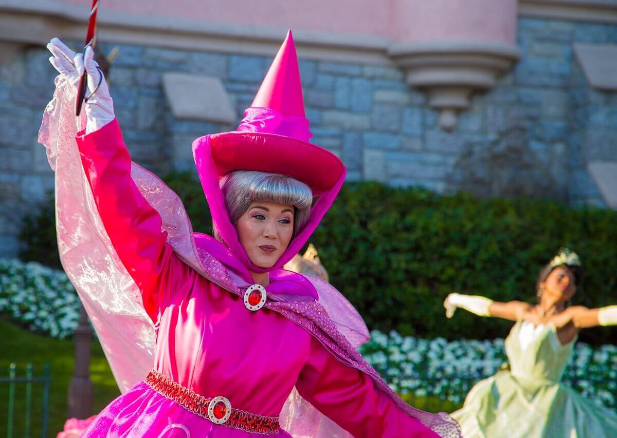 Fairy Flora Disney fairy Flora in her red robe dances at the parade
