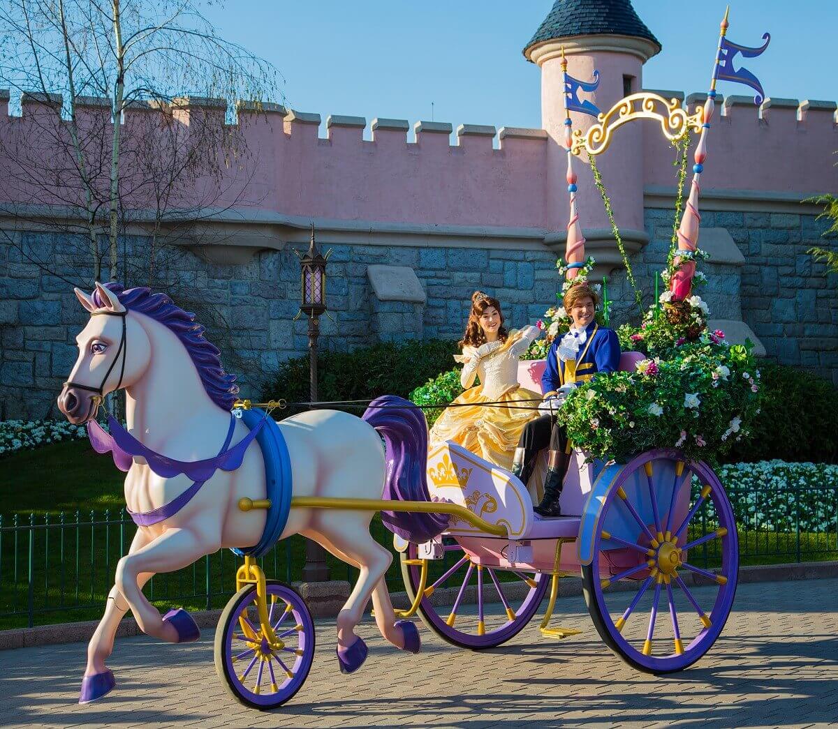 Carriage with Belle and Adam A horse pulls a carriage in which Belle and her prince Adam sit