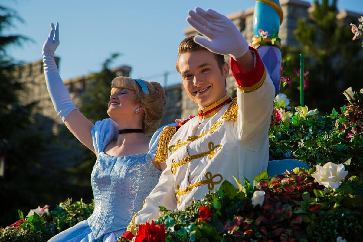 Cinderella and Prince Charmin wave Cinderall and Prince Charming sit in their carriage and wave to the audience
