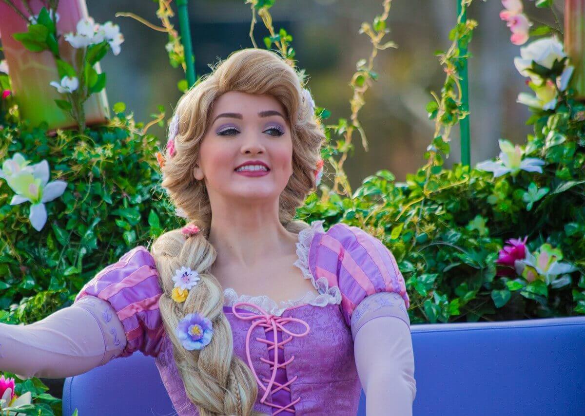 Disney Princess Rapunzel Disney Princess Rapunzel sits in her carriage decorated with greenery and flowers