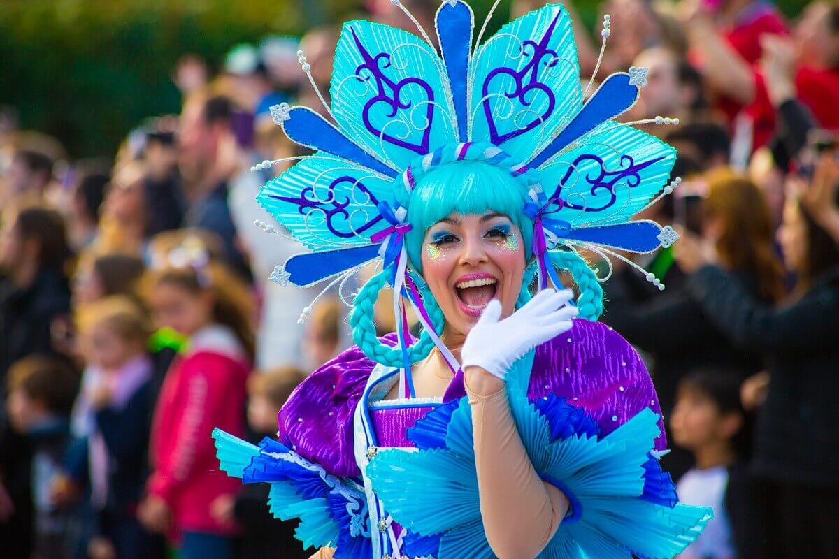 Laughing ice crystal A dancer wears a costume meant to represent an ice crystal and waves at the camera