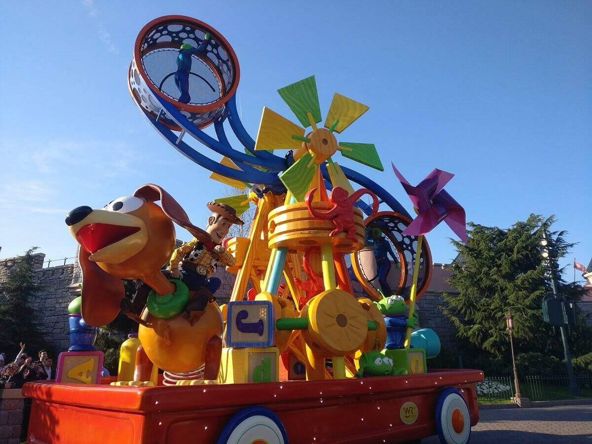 Slinky Dog Parade Float Slinky Dog and woody at the front of the colorful Toy Story parade float