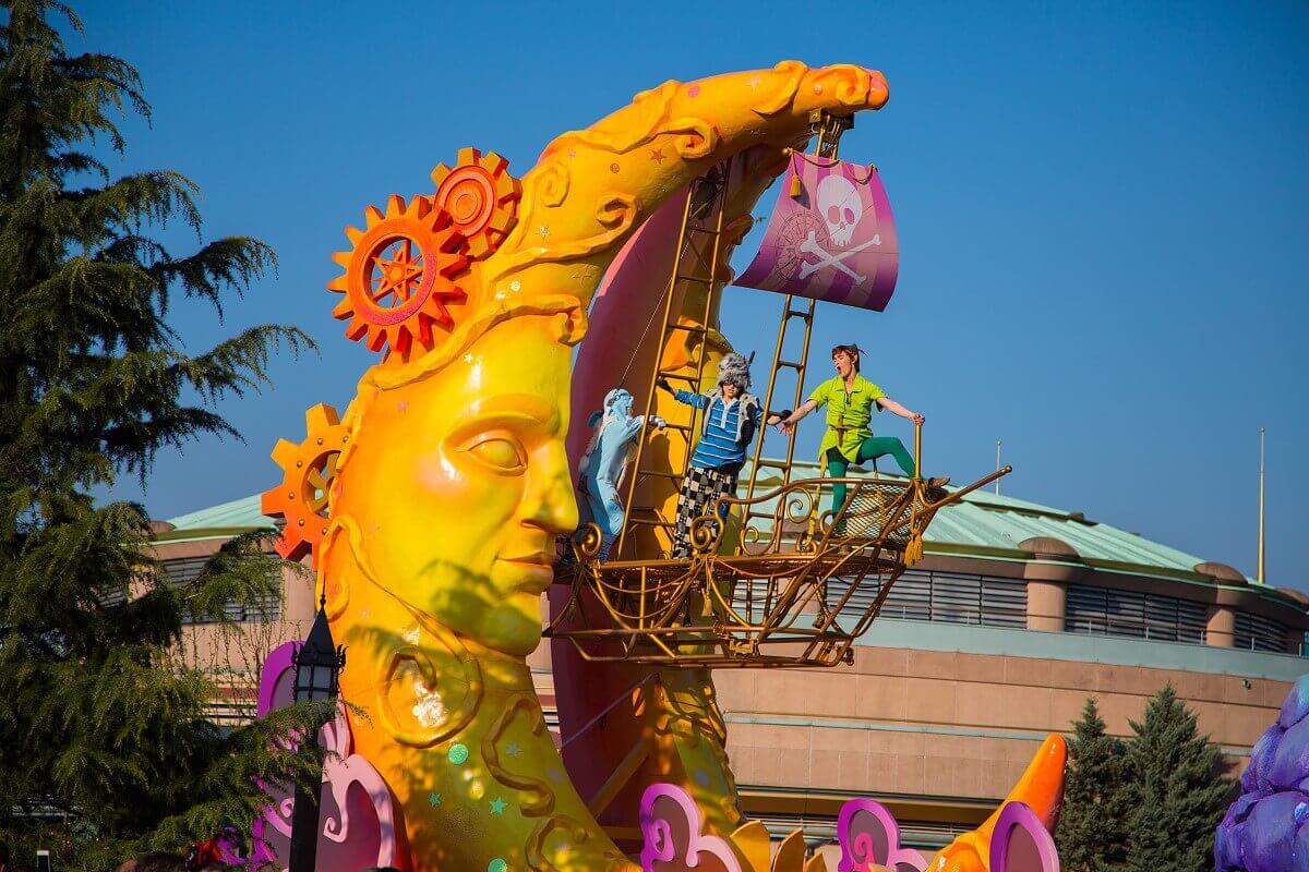 Peter Pan parade float A huge yellow crescent forms the parade float, at its head hangs a ship's swing in which Peter Pan stands