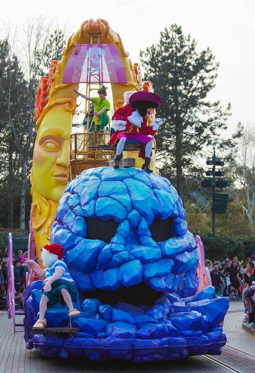 Frotal view of the Peter Pan parade float Frontal view of the Peter Pan parade float with the huge stone skull on which Captain Hook sits, Smee sits at the very front of the float, behind the skull is the large crescent moon from which Peter Pan hangs in his ship
