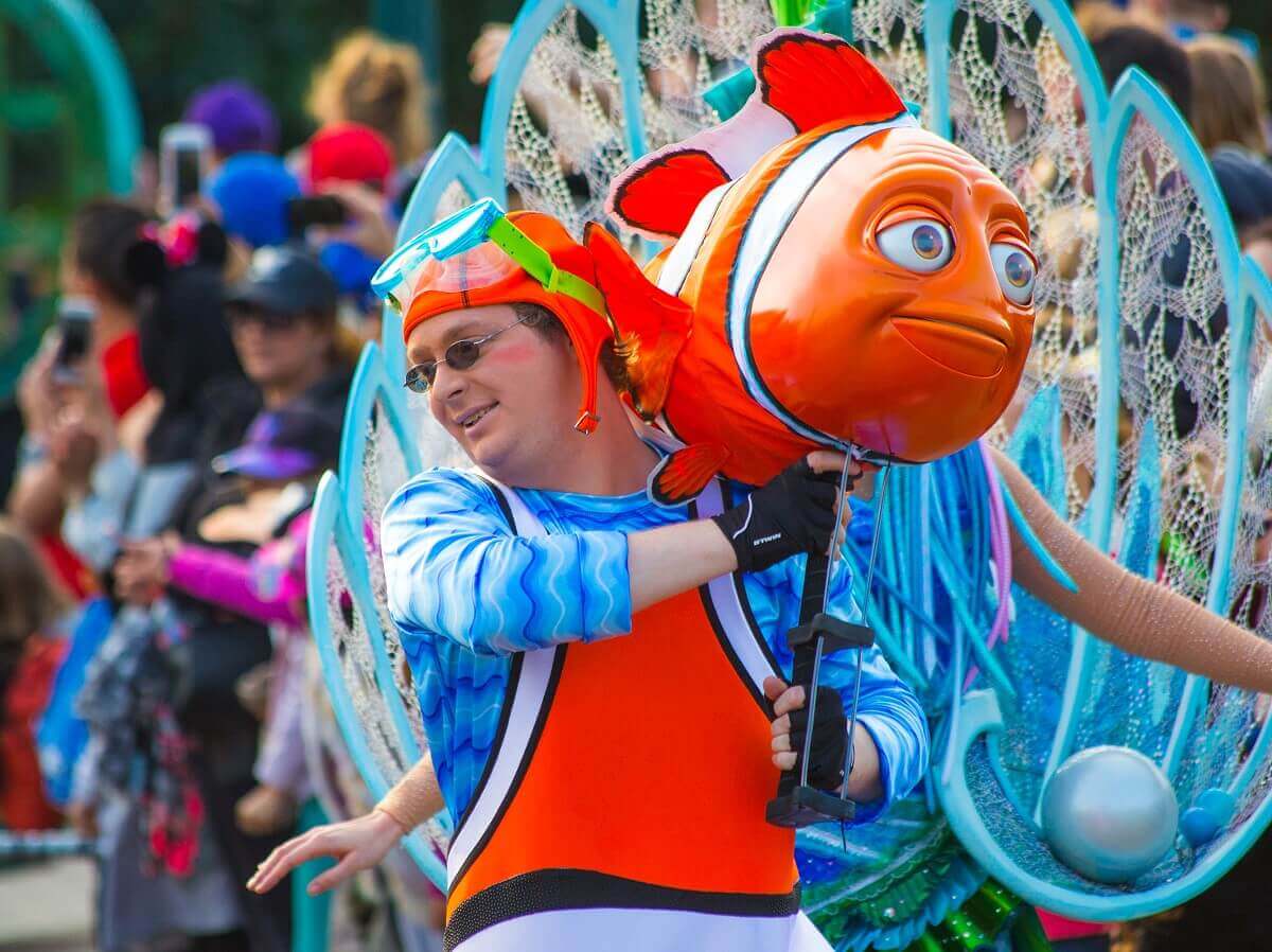 Dancer with clown fish A dancer wears a figurine of a clown fish at Disney Stars on Parade