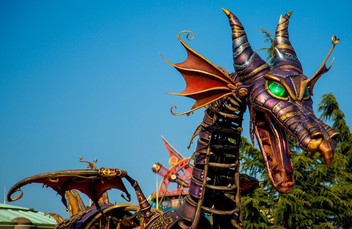 Dragon head with mouth ripped open Close-up of dragon head with wide open mouth and green glowing eyes