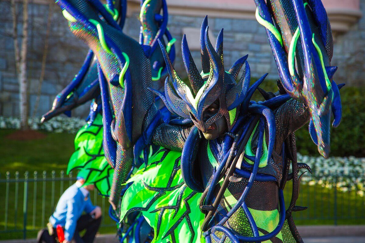 Thorny vine at the parade A parade dancer performs as a spiky thorny vine