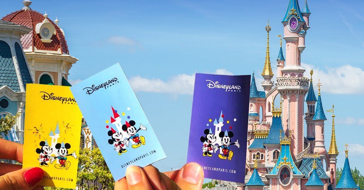 Disneyland Paris Tickets 3 tickets for Disneyland Paris in front of the castle. The tickets are held up in the air