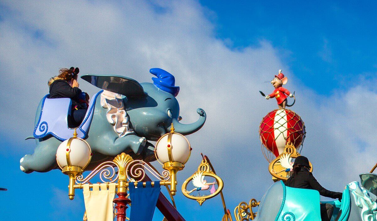 Dumbo and Timothy a carriage of the carousel Dumbo - The Flying Elephant flies at the height of a small figure of the mouse Timotheus