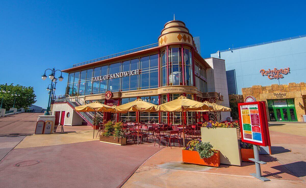 The large Earl of Sandwich building from the sea side The big Earl of Sandwich building from the seaside. Imposing glass facade, in front of a terrace and on the right you can see one of the entrances of the Rainforest Cafe.