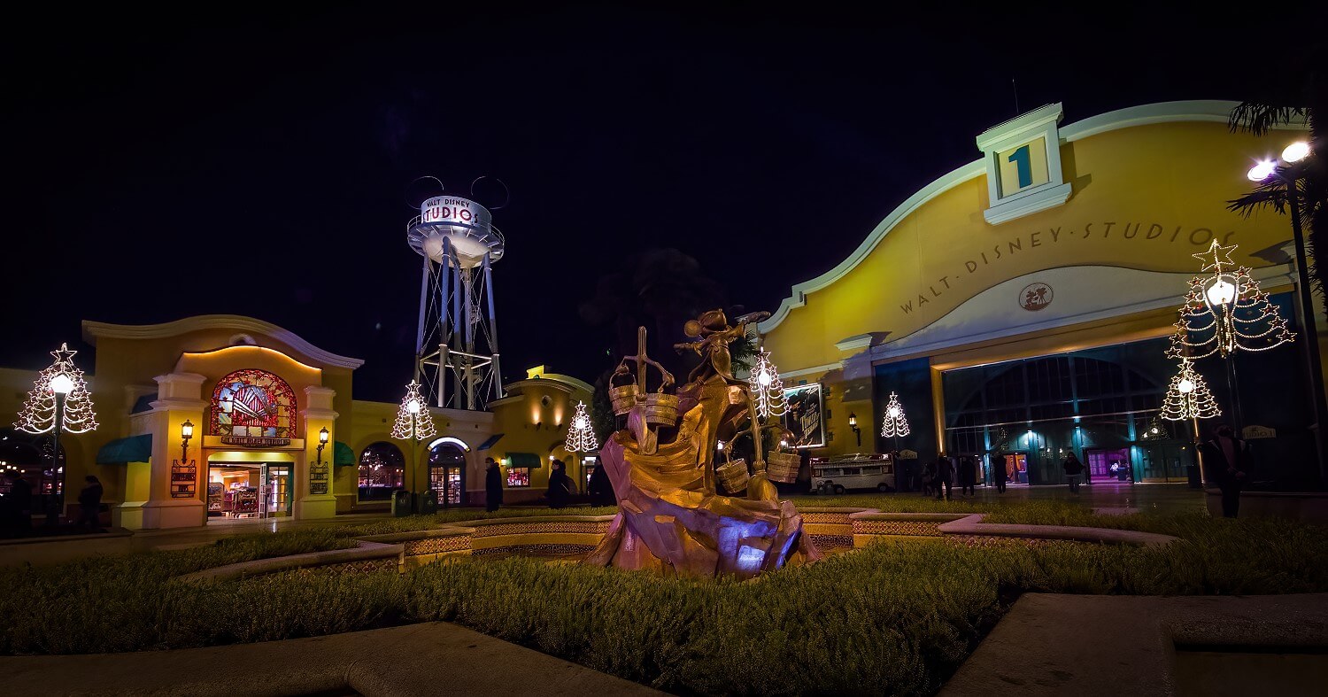 Wide shot of the Front Lot at night Long shot of the Front Lot at night, in the foreground the Mickey as Sorcerer's Apprentice fountain, in the background Studio 1, Walt Disney Studios Store & Earfell Tower