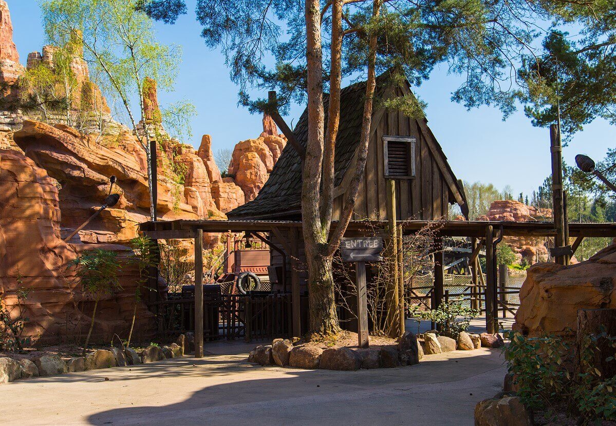 Wooden hut in frontierland To the left of a wooden hut is the former entrance to a now inaccessible attraction in Frontierland