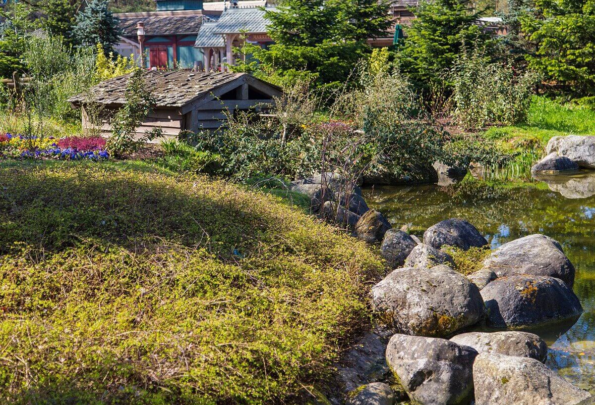Nature in Frontierland View of green meadows and a small river near Arendelle Village in the back of Frontierland.