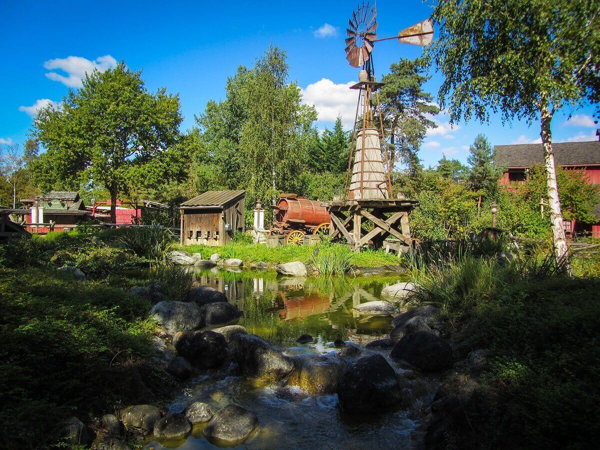Surroundings around Cottonwood Creek Ranch View of a green landscape with a small creek near the Cottonwood Creek Ranch