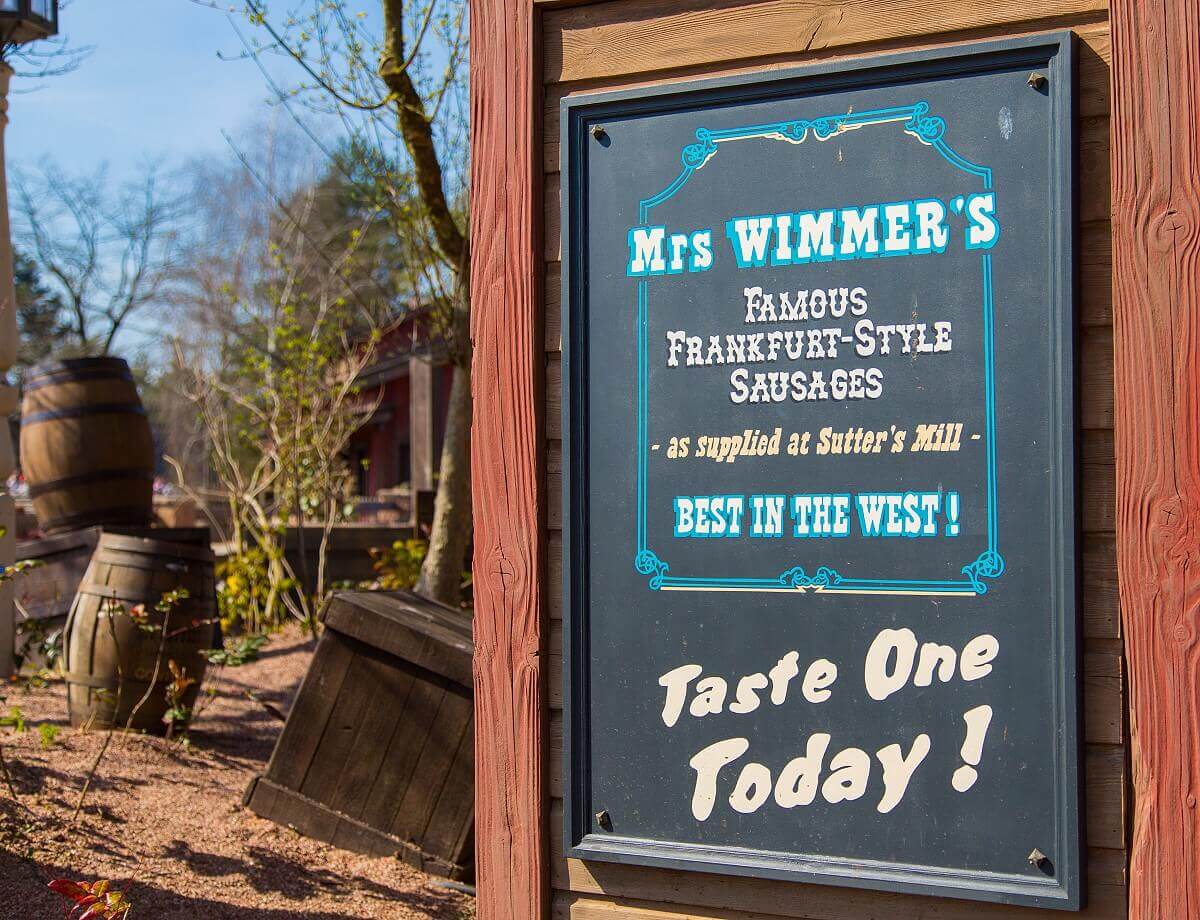 Advertising sign of a sausage seller A big board in Frontierland advertises delicious sausages made by Mrs. Wimmer