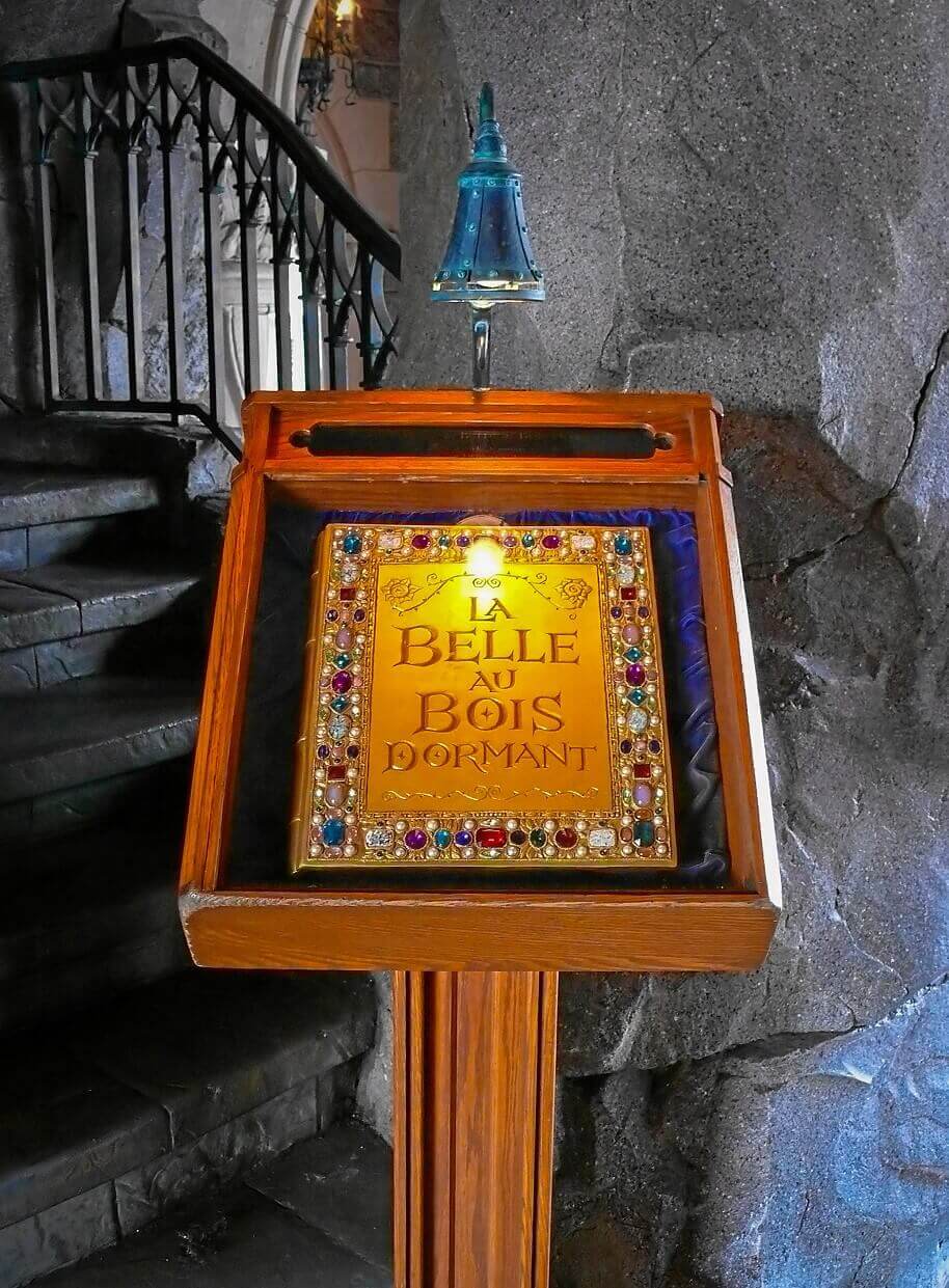 Fairy tale book in showcase A lead-lit showcase presenting a fairy tale book decorated with precious stones