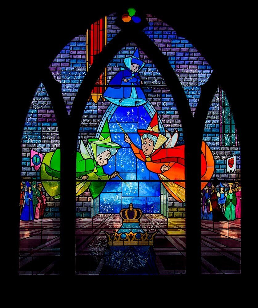 The three fairies The three fairies on a leaded glass window in the gallery of Sleeping Beauty Castle