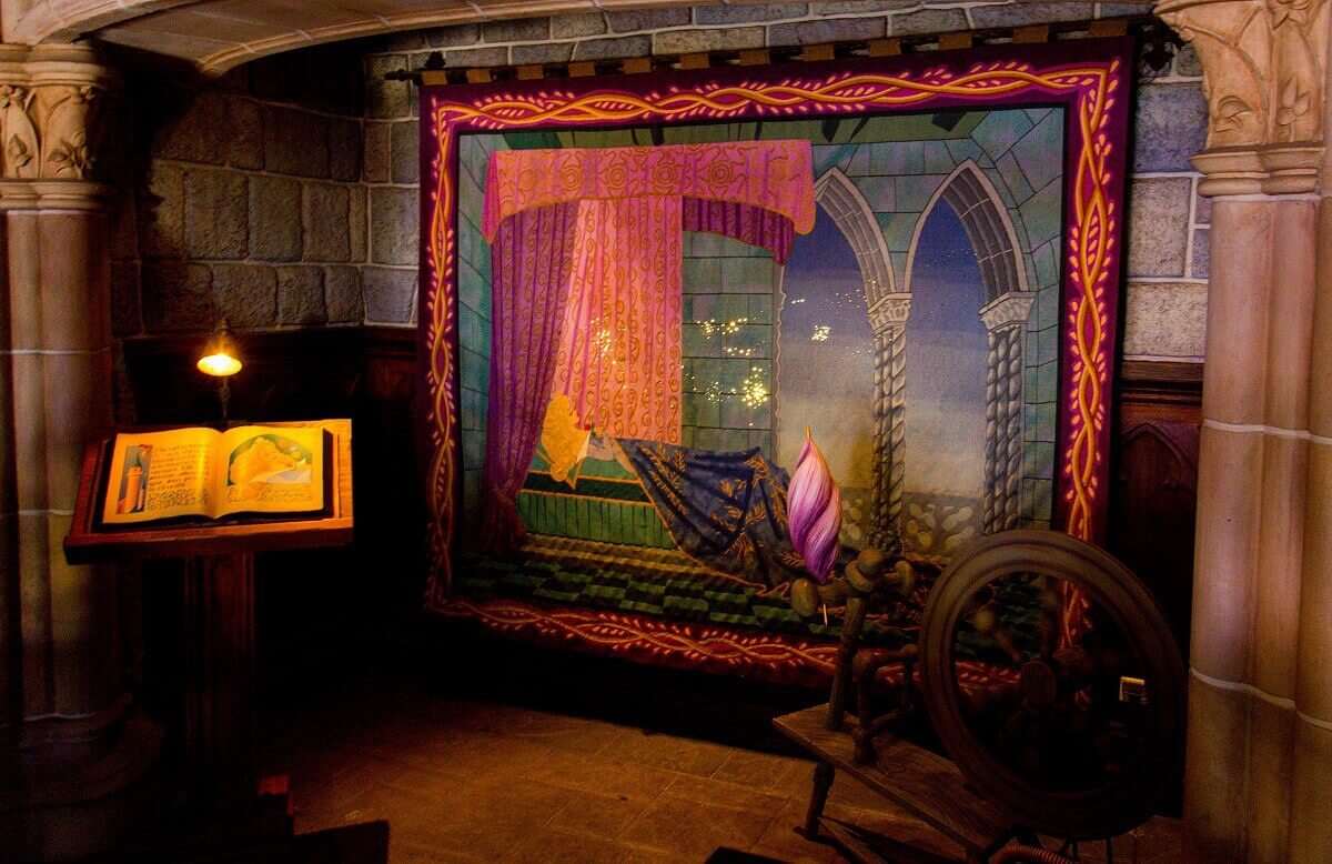 Tapestry in Sleeping Beauty Castle Tapestry in Sleeping Beauty Castle showing Sleeping Beauty, right in front of it the spinning wheel