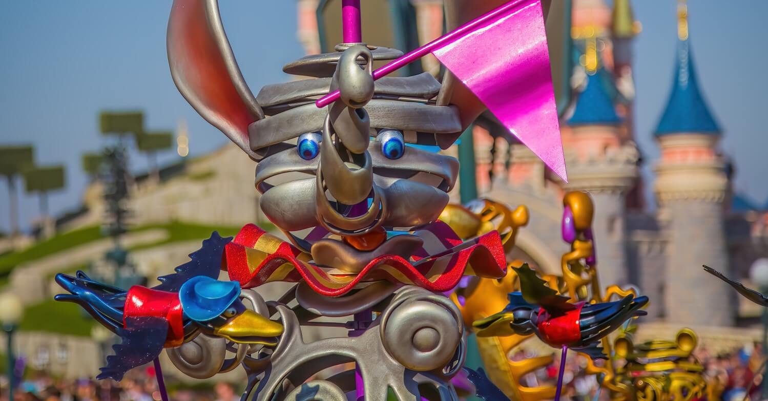 Dumbo decorative figure Artistically designed Dumbo figure placed in front of Sleeping Beauty Castle. Dumbo holds a pink pennant in his trunk