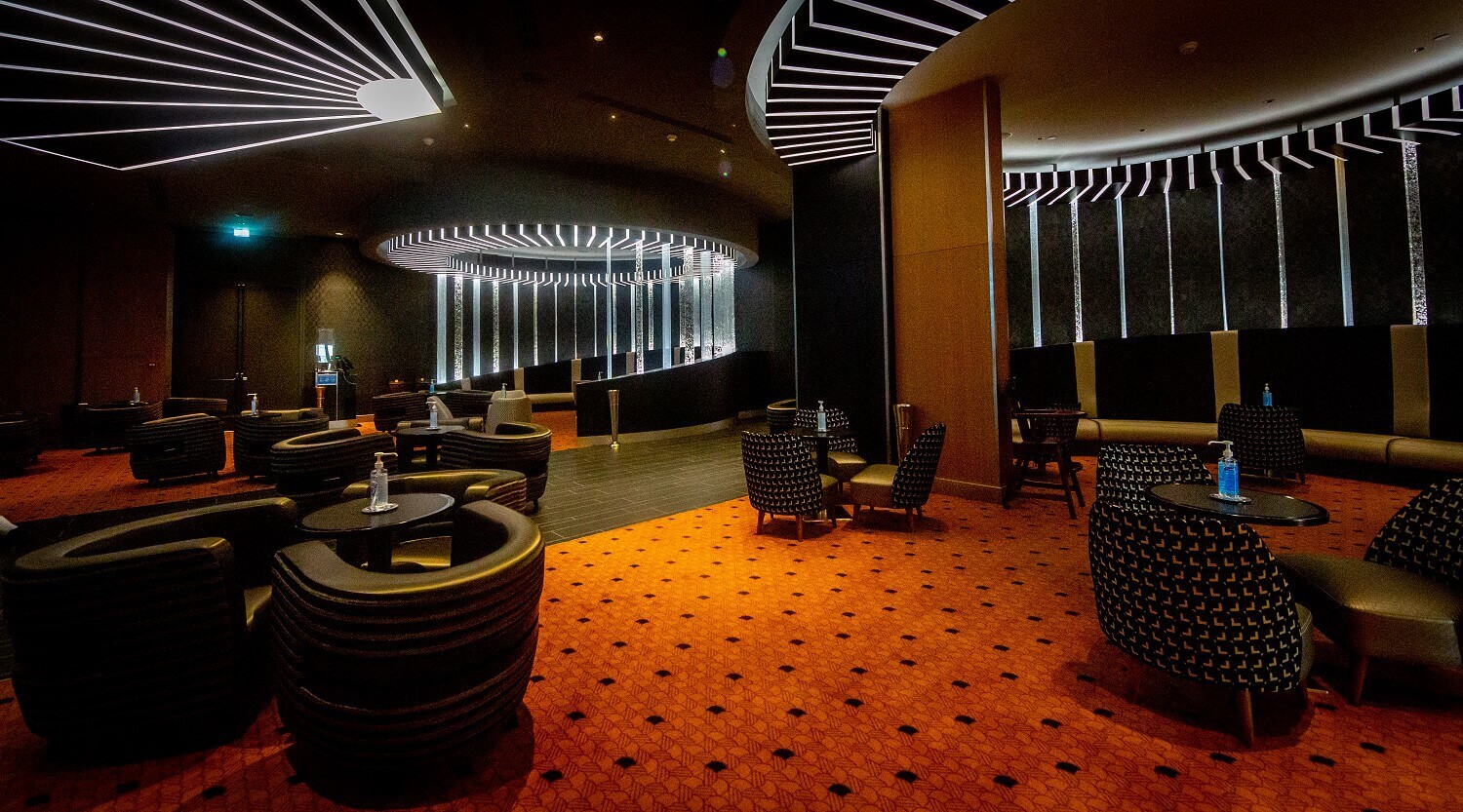 Skyline Bar Cozy leather armchairs on a red carpet. Futuristic ceilings and wall lighting.