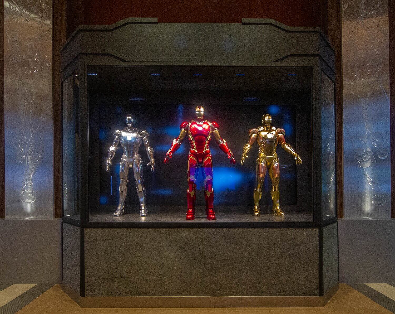 Ironman Suits A large showcase with three life-size Ironman suits.