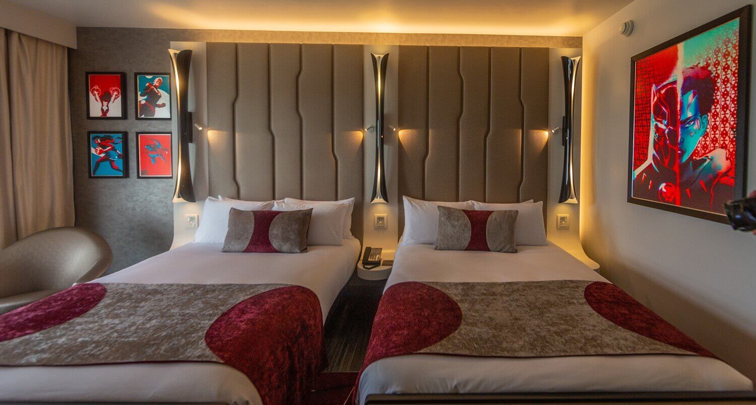 Empire State Club hotel room A hotel room in the Empire State Club with two double beds and pictures of Marvel heroes on the walls.