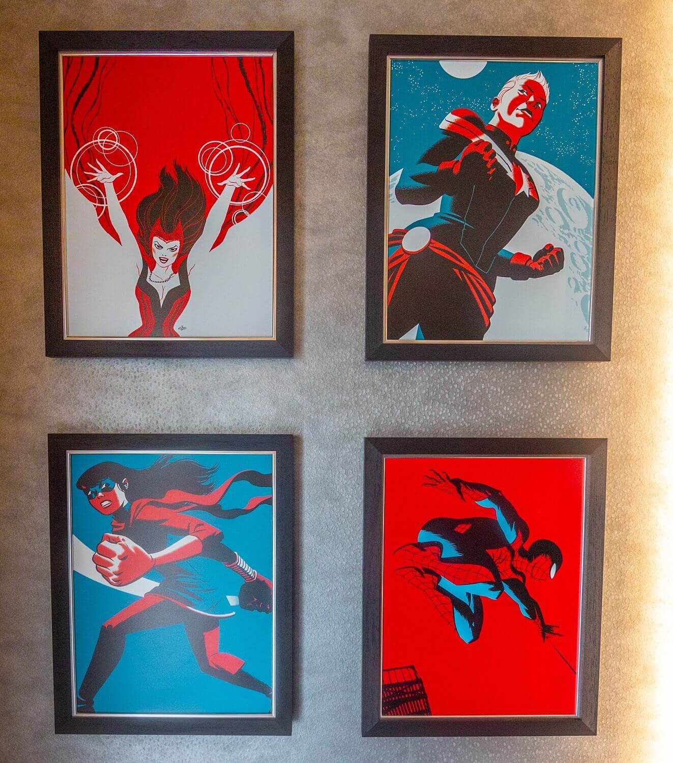 Marvel pictures on the wall Four pictures of Marvel heroes hang on the wall in the hotel room
